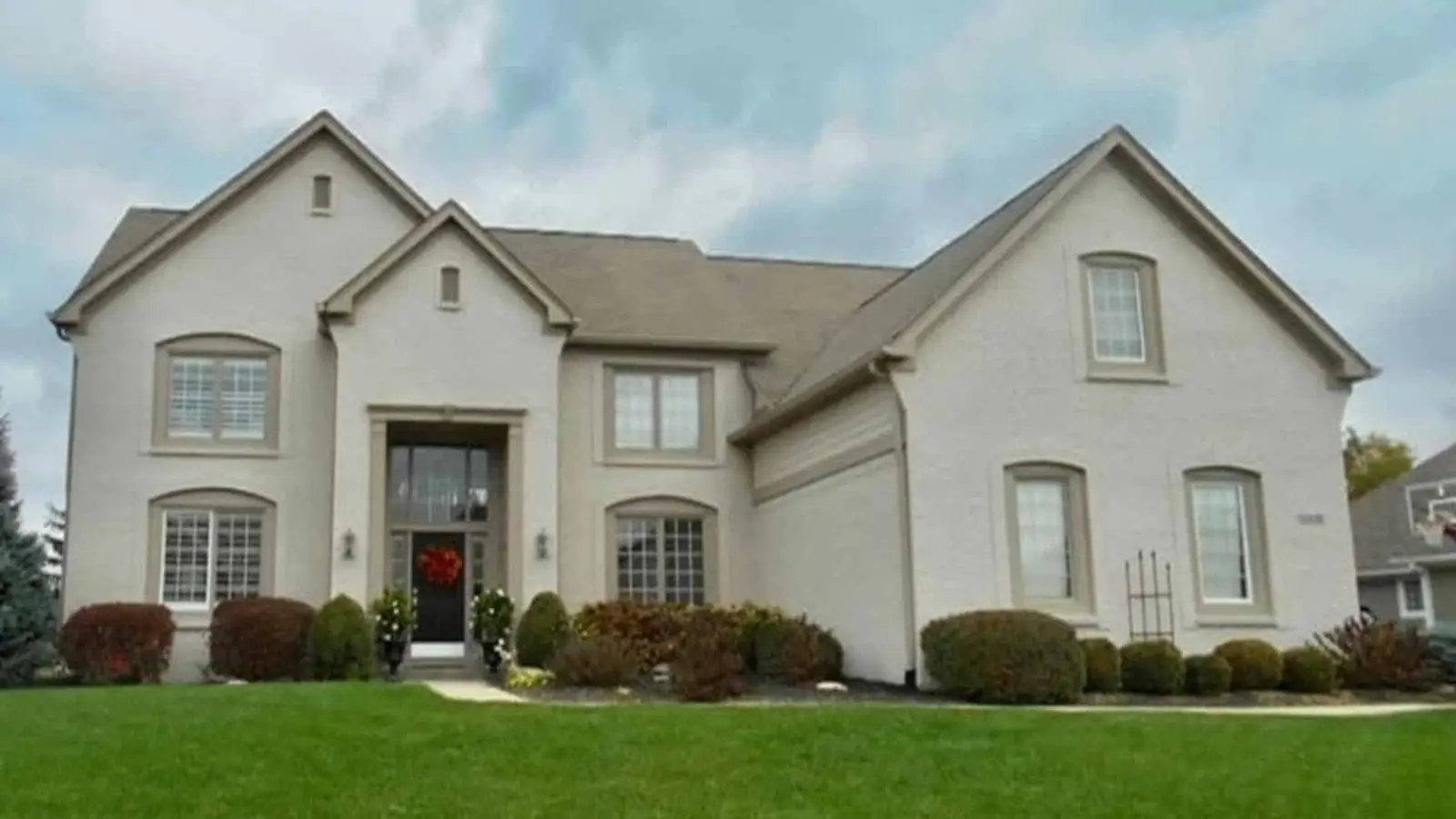Fishers home exterior before repaint by Guy Painting — dated red brick