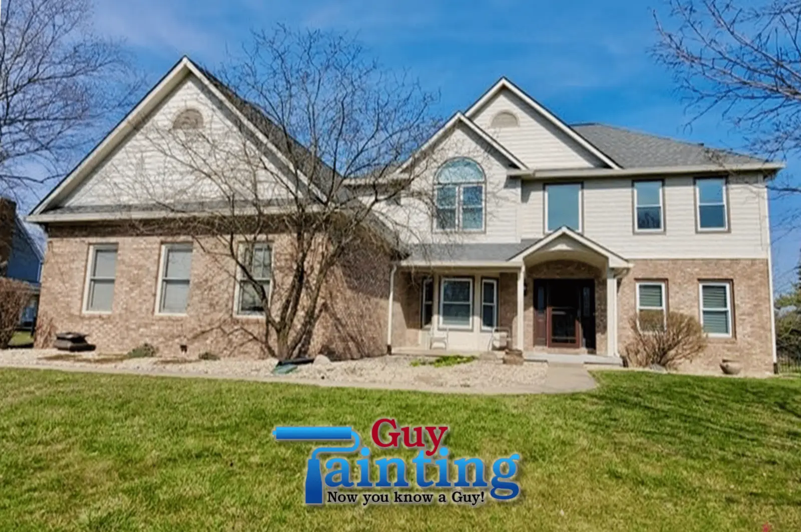 Two-story Carmel, IN home with original red brick and tan siding, before painting by Guy Painting