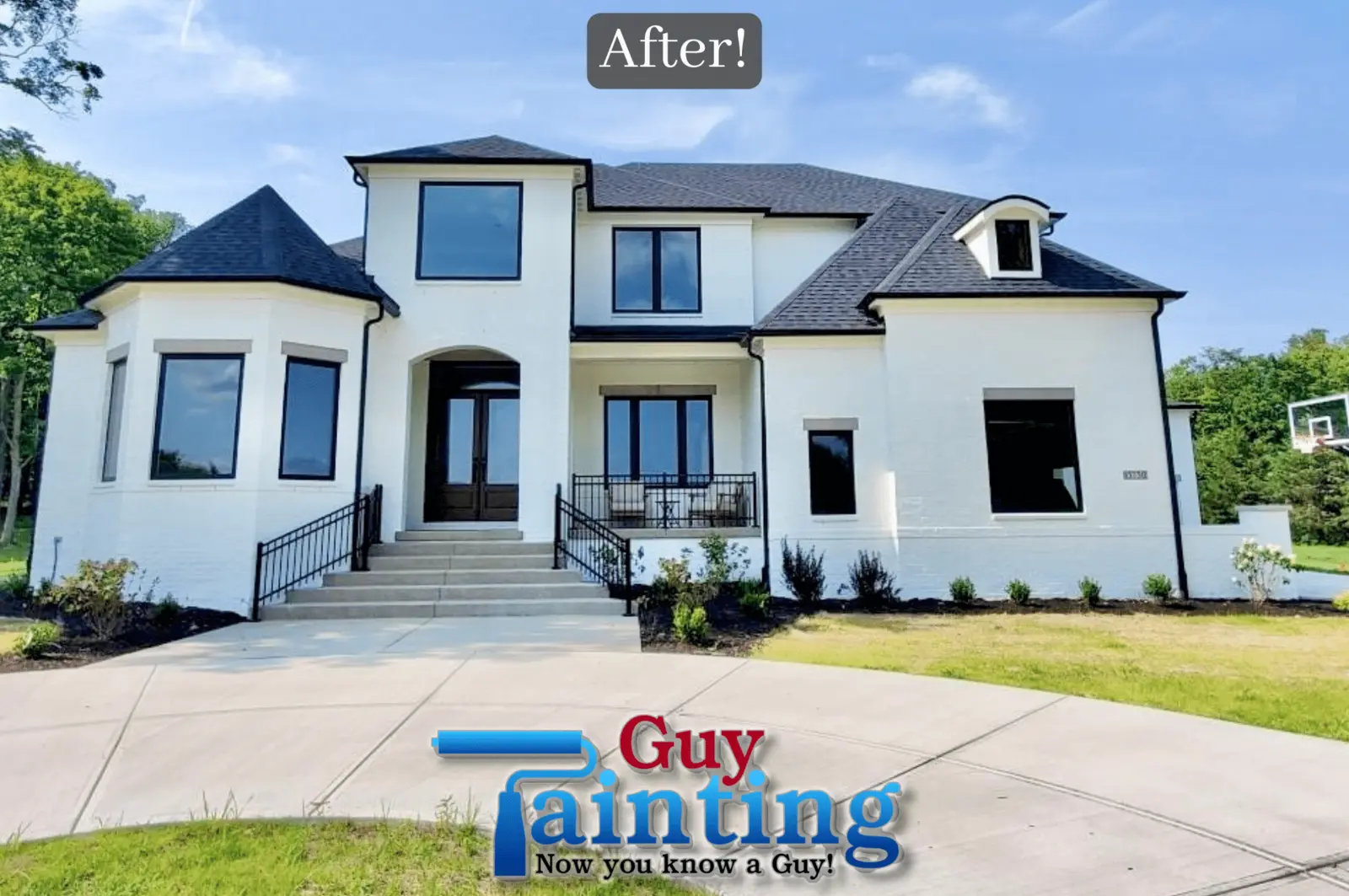 A high-angle architectural photograph capturing a stunning home exterior painting near me project in Geist. The large, multi-story residence features a pristine white brick finish that contrasts beautifully with the sharp black trim on the windows, doors, and roofline. The wide concrete driveway and professional landscaping lead up to a grand entryway, showcasing the detailed craftsmanship of the Guy Painting team. This "After!" shot highlights a complete modern transformation that enhances the curb appeal of this Fishers and Indianapolis area home.