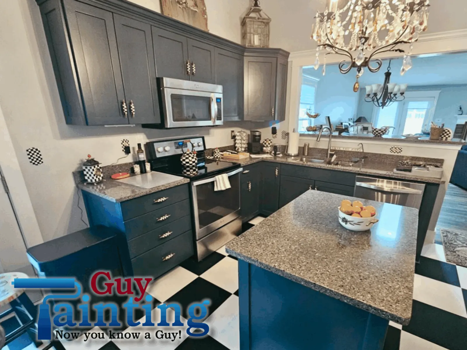 Same Geist lake house kitchen after Guy Painting's PPG Soothing Sapphire blue cabinet finish