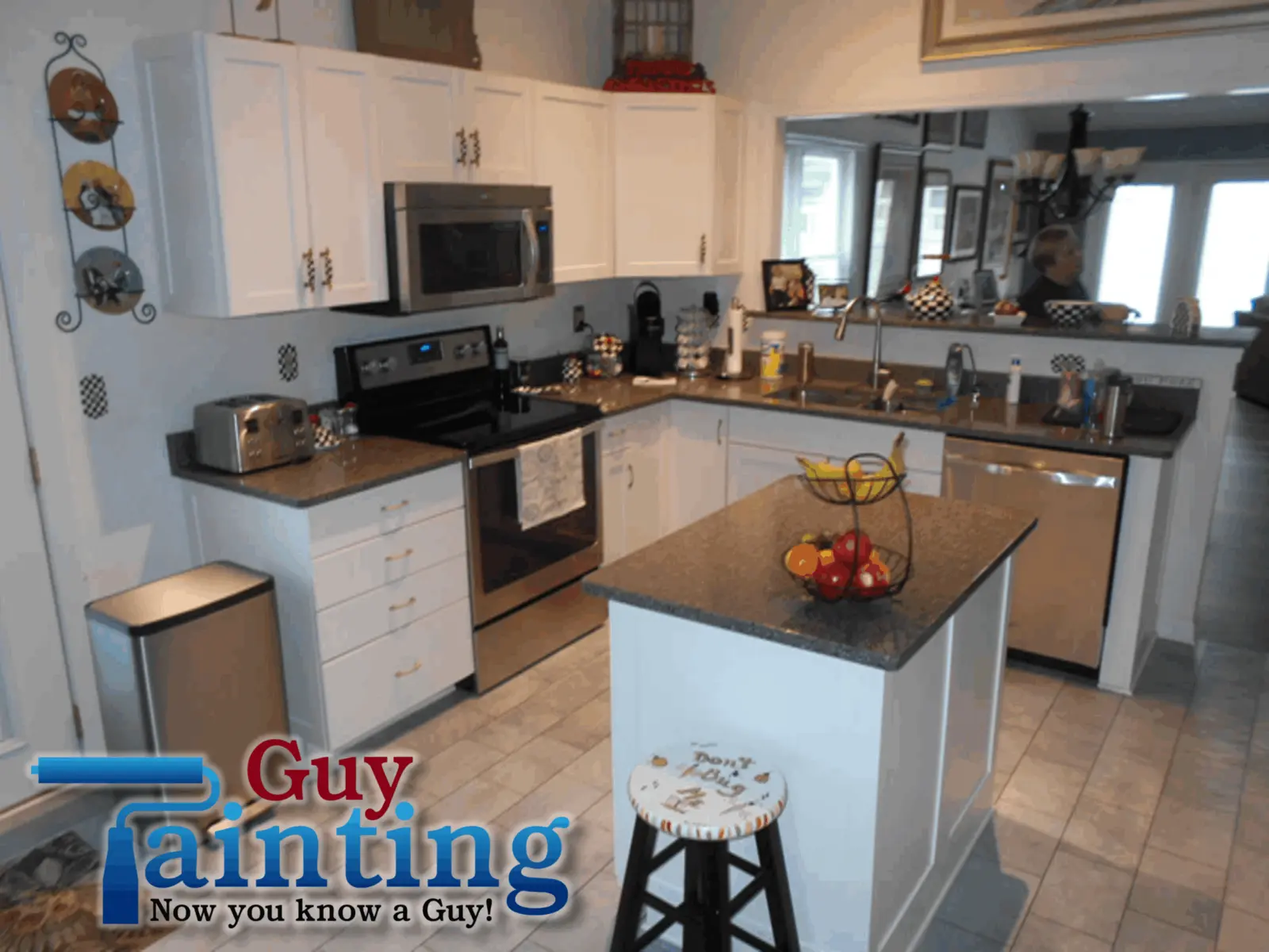 Geist lake house kitchen with checkered floor and original wood cabinets, before painting
